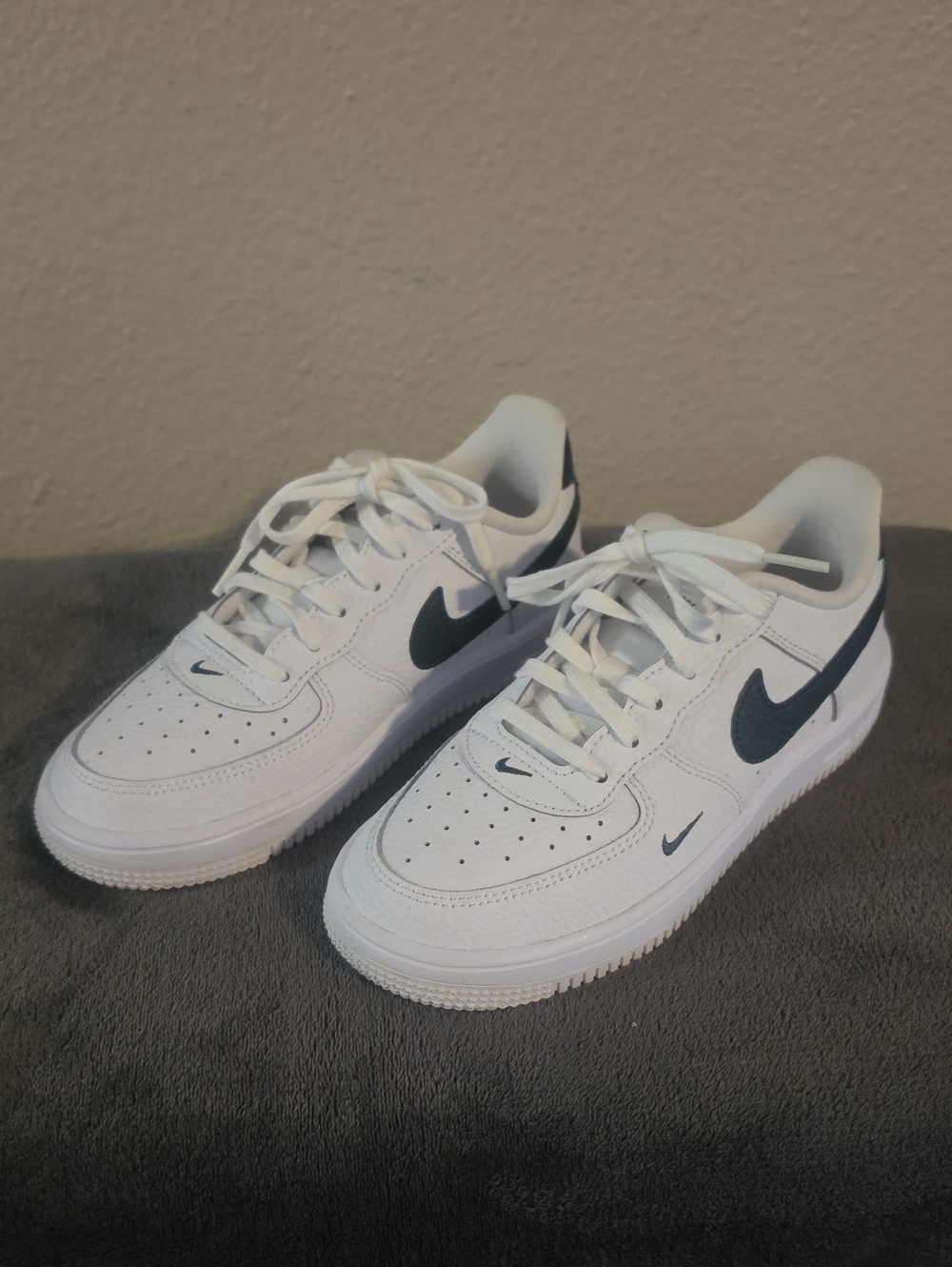 Nike White Low-Top Sneakers with Black Swoosh Accents